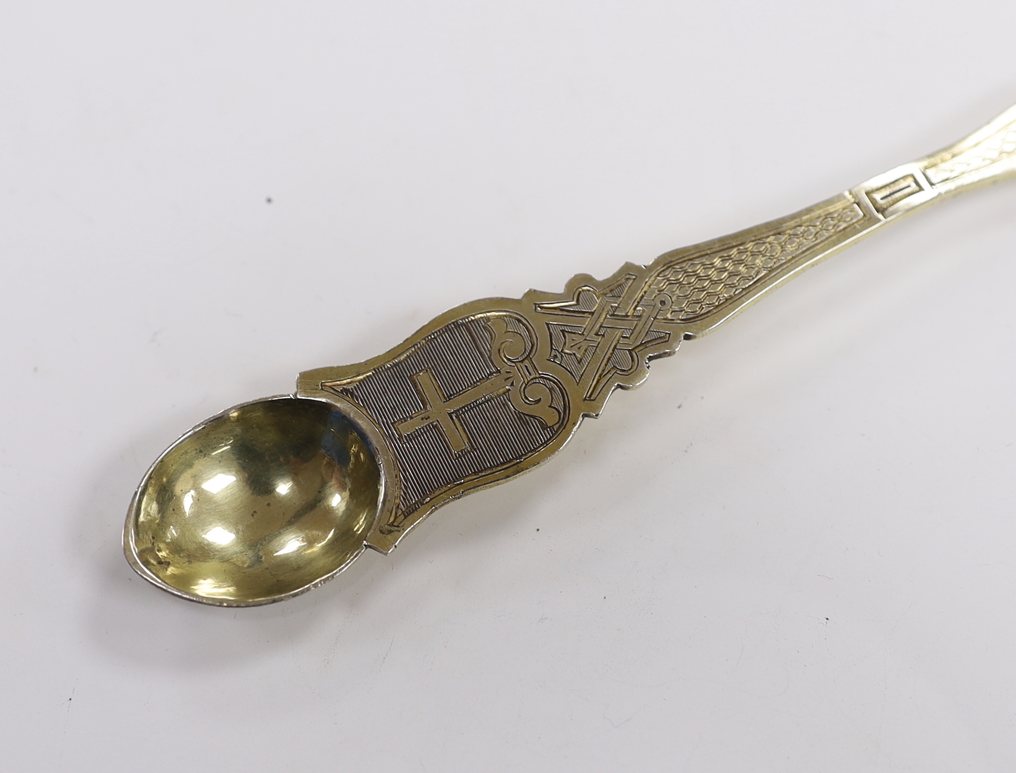 A late 19th/early 20th century Russian 84 zolotnik gilt anointing spoon, with engraved decoration, 22.9cm, 75 grams.